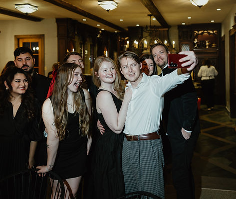 Guests taking a group photo inside the venue during a single-day corporate event