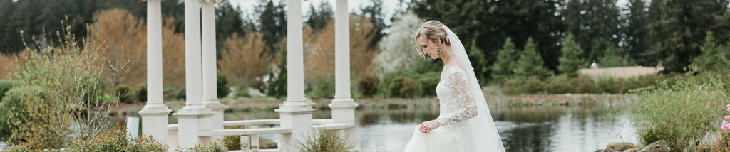 Bride walking through the gardens and gazebo at Chateau de Lis