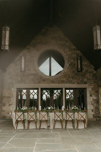 Stone garden archway wrapped in vines and delicate spring blooms
